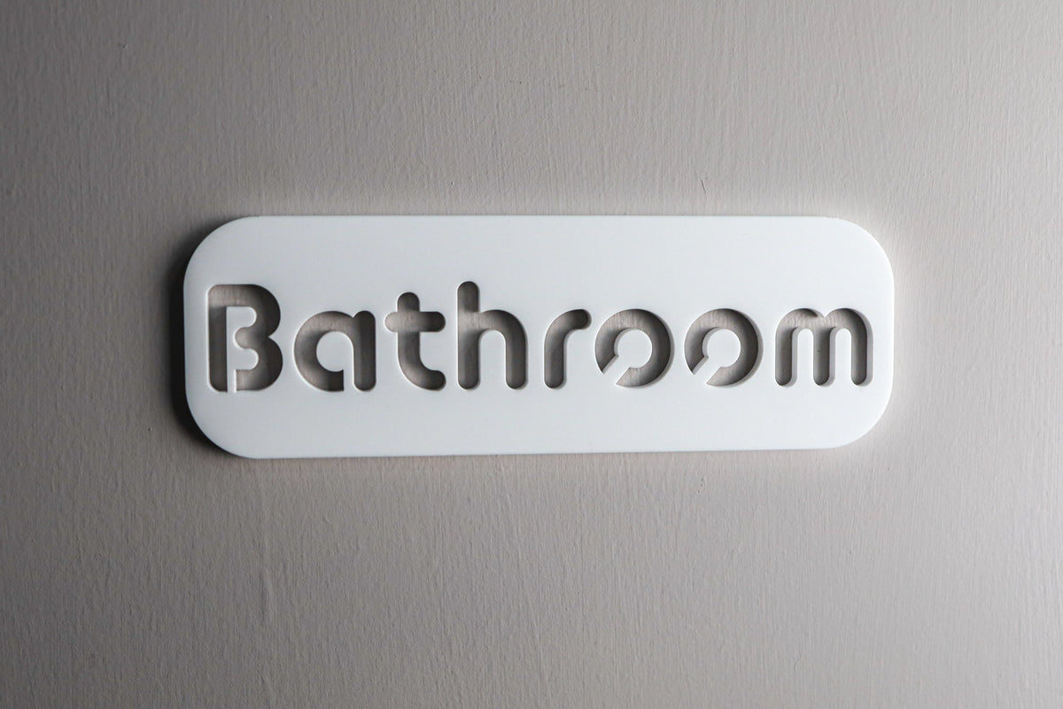 White stone-effect acrylic bathroom door sign