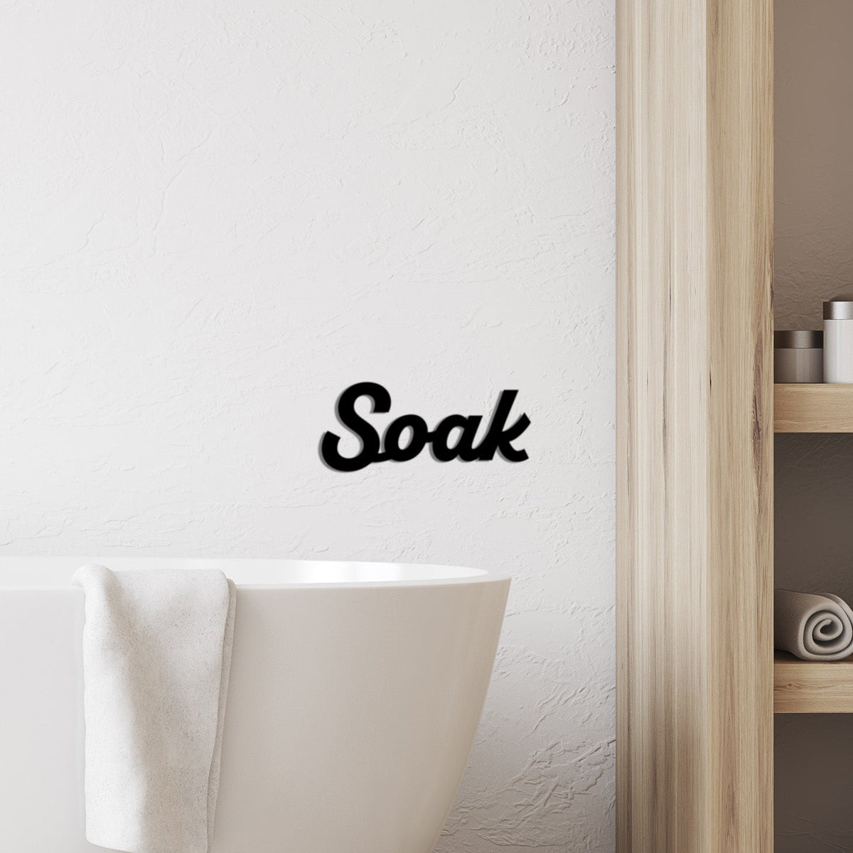 Black Soak word sign styled on a bathroom wall