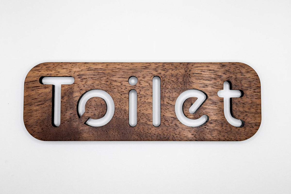 Walnut toilet door sign with toilet lettering