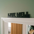 Modern black inspirational sign for wellness and contemporary spaces