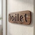 Walnut toilet door sign with cut-out Toilet lettering for cafés, offices and hotels