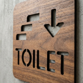 Walnut toilet wayfinding sign for commercial staircases, corridors and reception areas